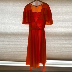 Orange Eloquii ruffle cape wrap dress